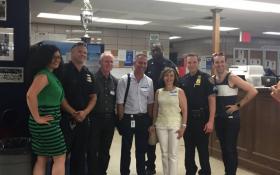 Greenwich Village-Chelsea Chamber of Commerce members posing for a photo with Sixth Precinct officers, including Maria Diaz, G.V.C.C. executive director, at far left; Ken Russo, fourth from left; Rocio Sanz, third from right; and Mathew Heggem, far right.